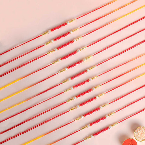 Assortment of 12 Rakhis, featuring different designs, threads, and embellishments for Raksha Bandhan. Indiaβs Largest Pooja Accessories Brand - www.satvikstore.in