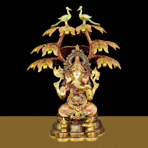 16.5-inch brass idol of Lord Ganesha sitting under a peacock-themed tree, symbolizing wisdom, prosperity, and artistic beauty for home and temple decor. Indiaβs Largest Brass Idols Brand - www.satvikstore.in