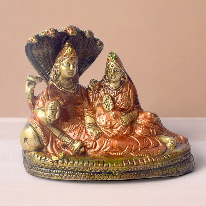 The 4.7 Inch Vishnu Ji Resting on Snake - Small Divine Figure is a beautifully crafted miniature statue that showcases Lord Vishnu in a serene and tranquil pose. Resting gracefully on the multi-headed serpent, Sheshnag, this divine figure symbolizes the eternal peace and protection Vishnu provides to the universe.