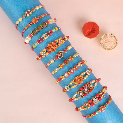Assortment of 12 Rakhis, featuring different designs, threads, and embellishments for Raksha Bandhan. Indiaβs Largest Pooja Accessories Brand - www.satvikstore.in
