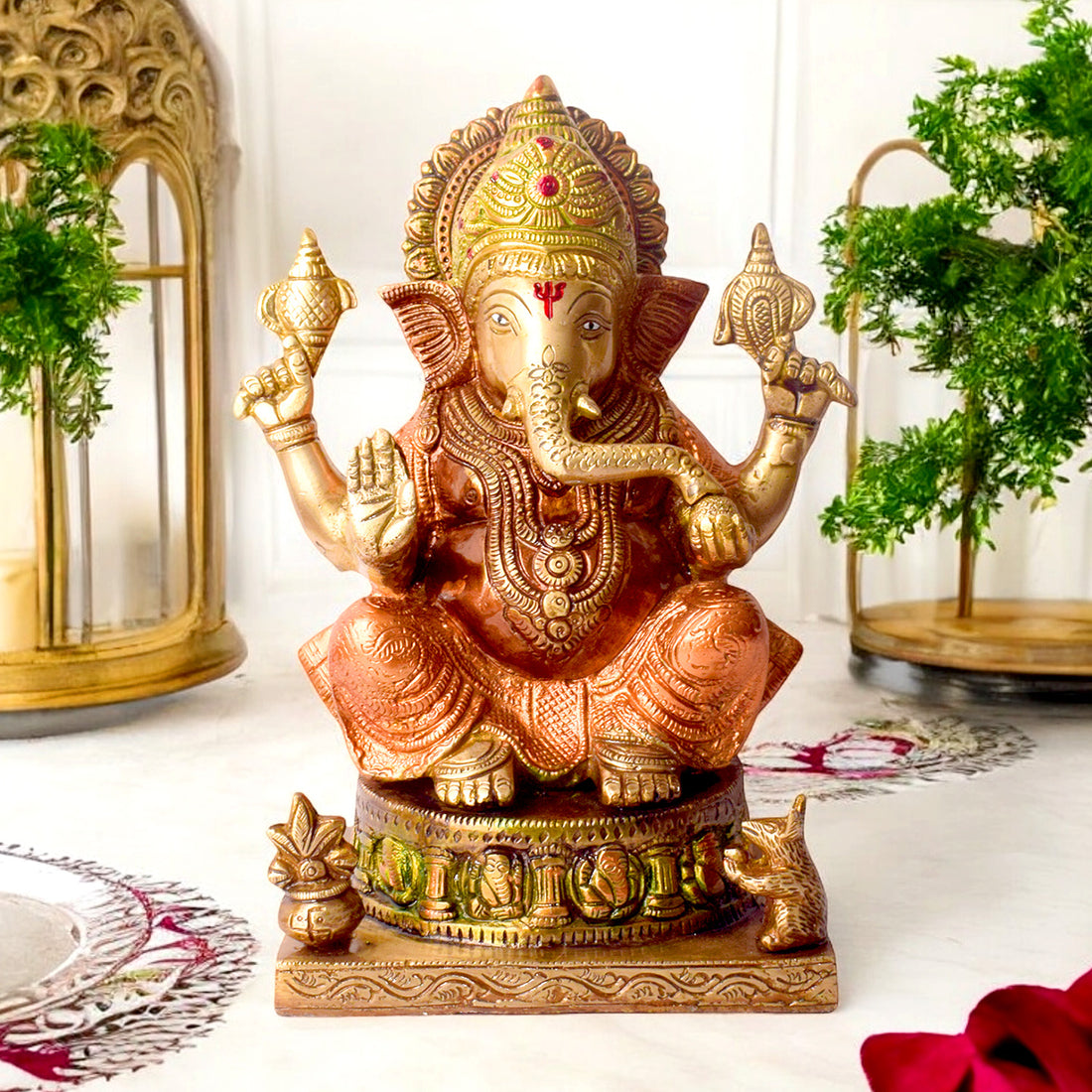 8.7 Inch Brass Idol of Colored Brass Ganesh Statue. Enhance your home with the vibrant charm of this Colored Brass Ganesh Statue, a perfect fusion of tradition and artistry. Crafted from high-quality brass and adorned with vivid hand-painted colors, this exquisite idol beautifully represents Lord Ganesha, the remover of obstacles and symbol of prosperity. India's Largest Puja Accessories Brand - Satvik