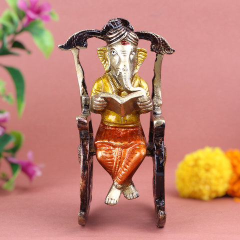 4.5 Inch Pure Brass Reading Book Ganesha Statue, beautifully crafted with intricate details of Lord Ganesha engrossed in reading, symbolizing wisdom, knowledge, and learning β ideal for study rooms. No.1 Brass Idol Store www.satvikstore.in