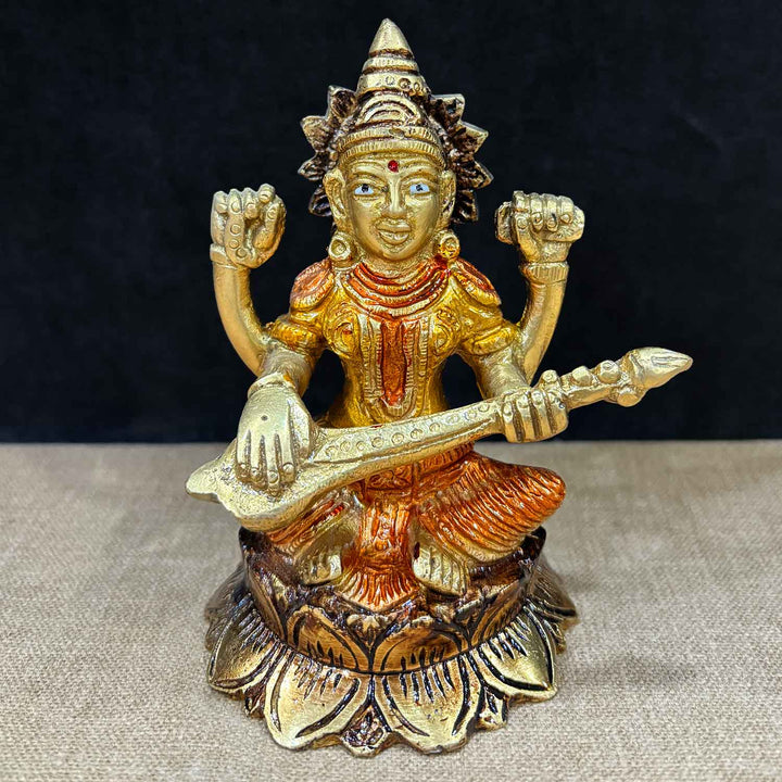 4.5 Inch Handcrafted Saraswati Statue in pure brass, showcasing the goddess of wisdom and arts seated gracefully with veena – ideal for home temple, study area, and spiritual gifting. No.1 Brass Idol Store www.satvikstore.in