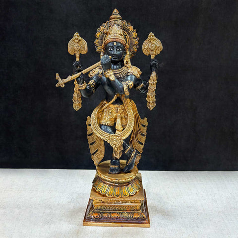 Brass Idol of 19 Inch Brass Chola Krishna Sculpture Playing the Flute. Bring home the divine charm of Lord Krishna with this exquisite 19-inch Brass Chola Krishna Sculpture. Expertly crafted, this statue captures Lord Krishna in his iconic pose, gracefully playing the flute. India's Largest Puja Accessories Brand - Satvik