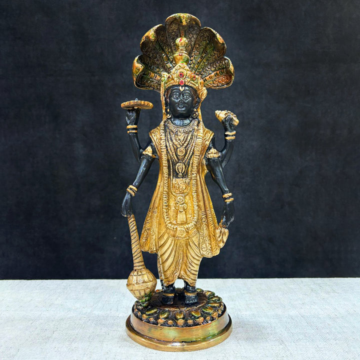 This elegant brass statue of Lord Vishnu seated on the mighty Seshnag is a powerful symbol of divine protection, balance, and cosmic order. The intricate craftsmanship beautifully depicts Lord Vishnu in his serene and majestic form, with the multi-headed Seshnag providing a protective canopy.  India's Largest Puja Accessories Brand - Satvik No. 1 Brass Idol Collection
