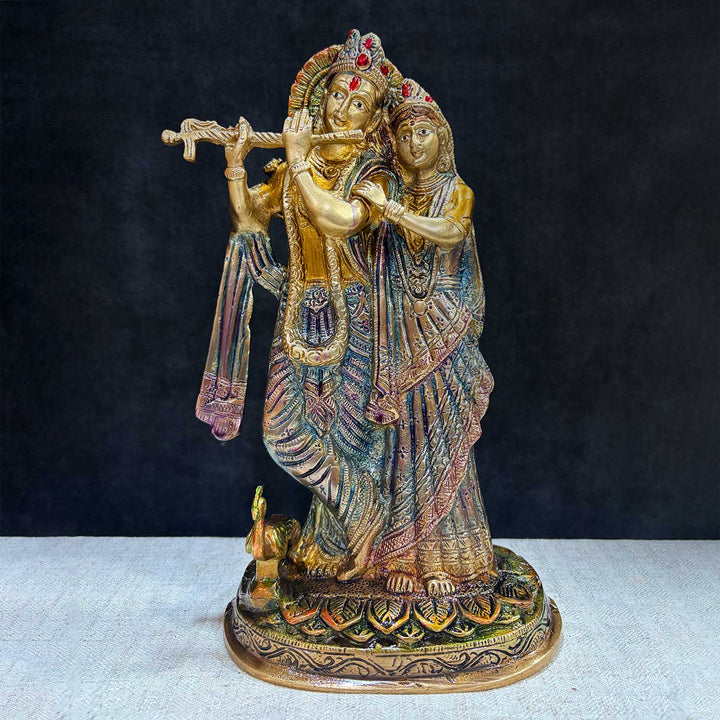 The 11.4-inch Radha Krishna β-Divine Harmony in a Sacred Sculpture is a breathtaking masterpiece that captures the eternal and divine bond between Radha and Krishna. This beautifully detailed idol showcases the couple in a serene and harmonious pose, with Krishna playing his mesmerizing flute and Radha standing gracefully by his side. India's Largest Puja Accessories Brand - Satvik No. 1 Brass Idol Collection