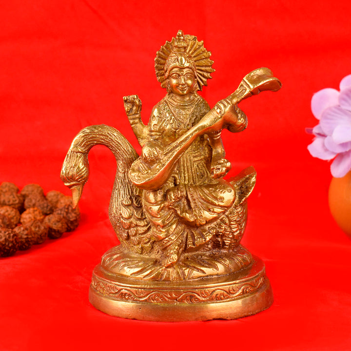 4.7 Inch Divine Brass Saraswati Maa Idol beautifully crafted, depicting the Goddess of knowledge and wisdom seated gracefully with a veena, ideal for home temple and spiritual décor. No.1 Brass Idol Store www.satvikstore.in