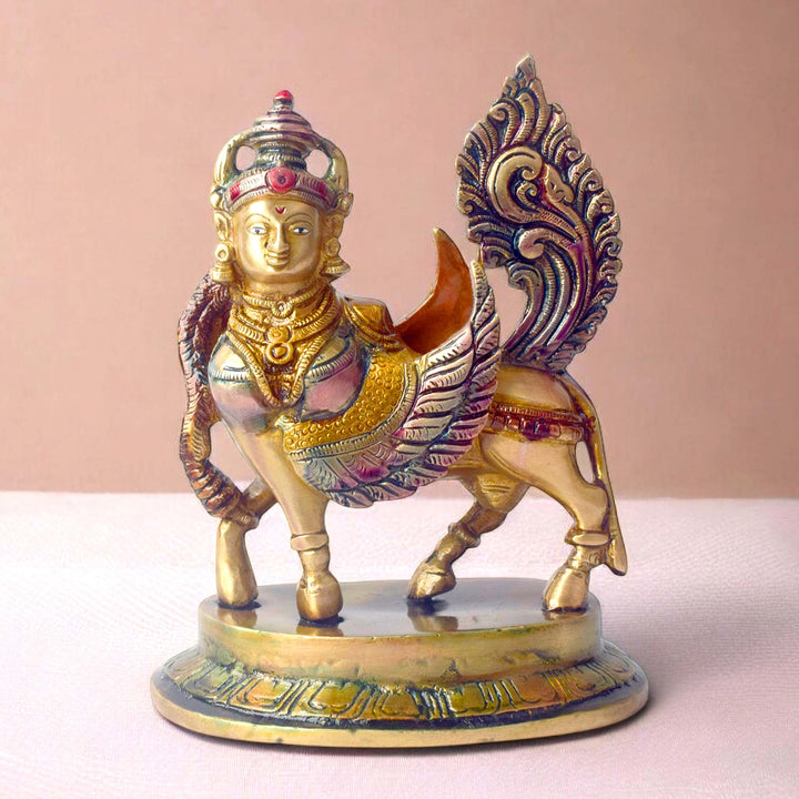 The "6.5 Inch Brass Kamdhenu Cow Statue" is a beautifully crafted representation of Kamdhenu, the sacred wish-fulfilling cow in Hindu mythology. Standing at 6.5 inches tall, this intricately designed statue is made from high-quality brass, showcasing exquisite detailing that highlights Kamdhenu's divine form, with a peaceful and nurturing presence.