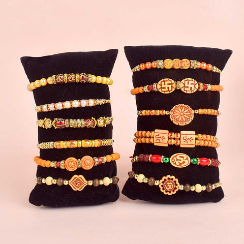 Assortment of 12 Rakhis, featuring different designs, threads, and embellishments for Raksha Bandhan. Indiaβs Largest Pooja Accessories Brand - www.satvikstore.in