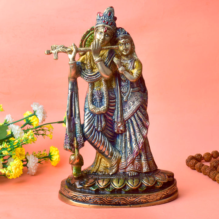 The 11.4 Inch Radha Krishna β Divine Harmony in a Sacred Sculpture is a breathtaking masterpiece that captures the eternal and divine bond between Radha and Krishna. This beautifully detailed idol showcases the couple in a serene and harmonious pose, with Krishna playing his mesmerizing flute and Radha standing gracefully by his side.