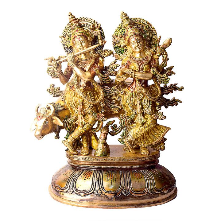 This Lovely Radha Krishna with Cow Colorful Brass Idol beautifully portrays the divine love and grace of Radha and Krishna, accompanied by the sacred cow. Handcrafted from high-quality brass and adorned with vibrant colors, this idol exudes spiritual charm and elegance.