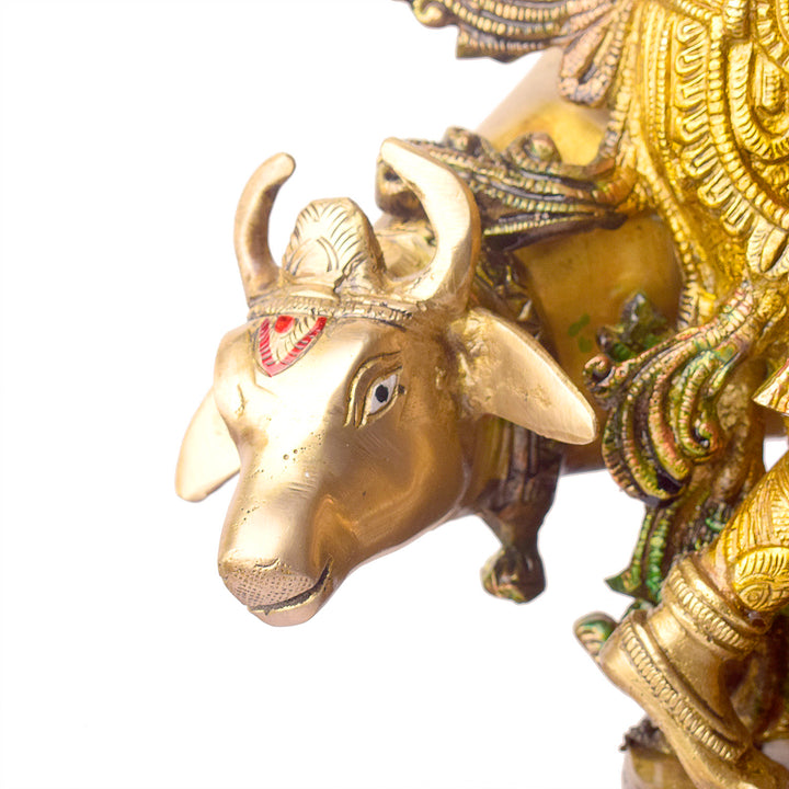 This Lovely Radha Krishna with Cow Colorful Brass Idol beautifully portrays the divine love and grace of Radha and Krishna, accompanied by the sacred cow. Handcrafted from high-quality brass and adorned with vibrant colors, this idol exudes spiritual charm and elegance.