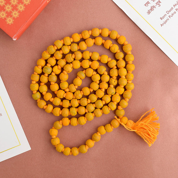 Natural Haldi (Turmeric) Jaap Mala, featuring vibrant turmeric-colored beads strung together, traditionally used for meditation, mantra chanting, and spiritual practices. India’s Premium Jap Mala Store- www.satvikstore.in