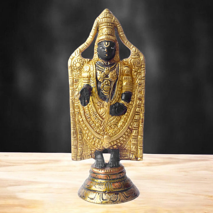This 8-inch Tirupati Balaji sculpture beautifully captures the divine form of Lord Venkateshwara, radiating blessings of peace, prosperity, and devotion. Handcrafted with intricate details, this idol represents the sacred energy and compassion of the Lord, bringing a sense of tranquility to your space.