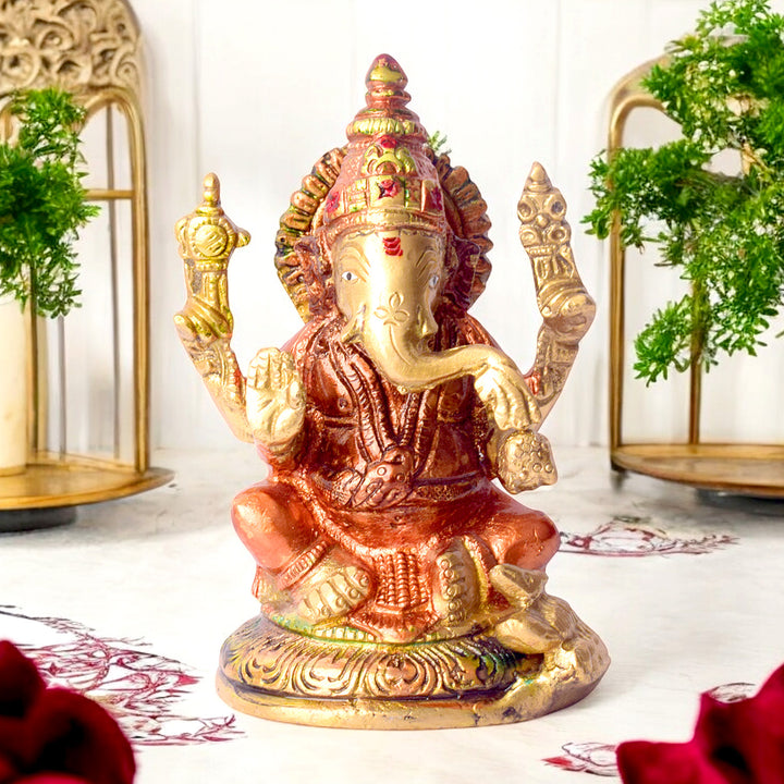 4.5 Inch Vibrant Colored Brass Ganesh Statue with detailed craftsmanship and rich colors ideal for home temple or festive décor. No.1 Brass Idol Store www.satvikstore.in