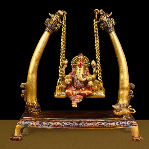 10.2-inch brass Ganpati idol seated on a decorative swing (jhula), beautifully crafted for devotion, home decor, and festive celebrations. India’s Largest Brass Idols Brand - www.satvikstore.in
