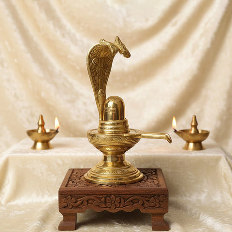 14.2-inch Brass Shivling with Nag Hood, intricately designed for divine worship and ideal for Shivratri rituals and spiritual décor. No.1 Brass Idol Store www.satvikstore.in 