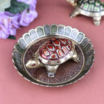 Brass Colored Turtle with Nakashi Plate/Tray (Red) – A vibrant fusion of red energy and intricate Nakashi craftsmanship, bringing prosperity and positive energy to your space. India’s Largest Pooja Accessories Brand – www.satvikstore.in