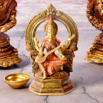 9.2 Inch Brass Goddess Saraswati Statue depicting the deity seated gracefully with veena, symbolizing wisdom, knowledge, and arts, ideal for home temple or study décor. No.1 Brass Idol Store www.satvikstore.in 