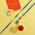 Designer Couple Rakhi Set for Bhaiya and Bhabhi with Roli Chawal and Ram Sita Stickers – Raksha Bandhan Gift Combo. India’s Largest Brass Idols Brand - www.satvikstore.in