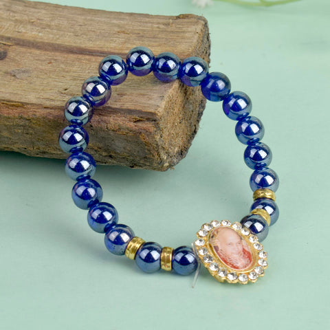 Dark Blue Shiny Beads Single Layer Guruji Swaroop Bracelet featuring shimmering dark blue beads and Jai Guruji Swaroop – perfect for minimalist spiritual wear, meditation, and gifting. India’s Largest Pooja Accessories Brand – www.satvikstore.in