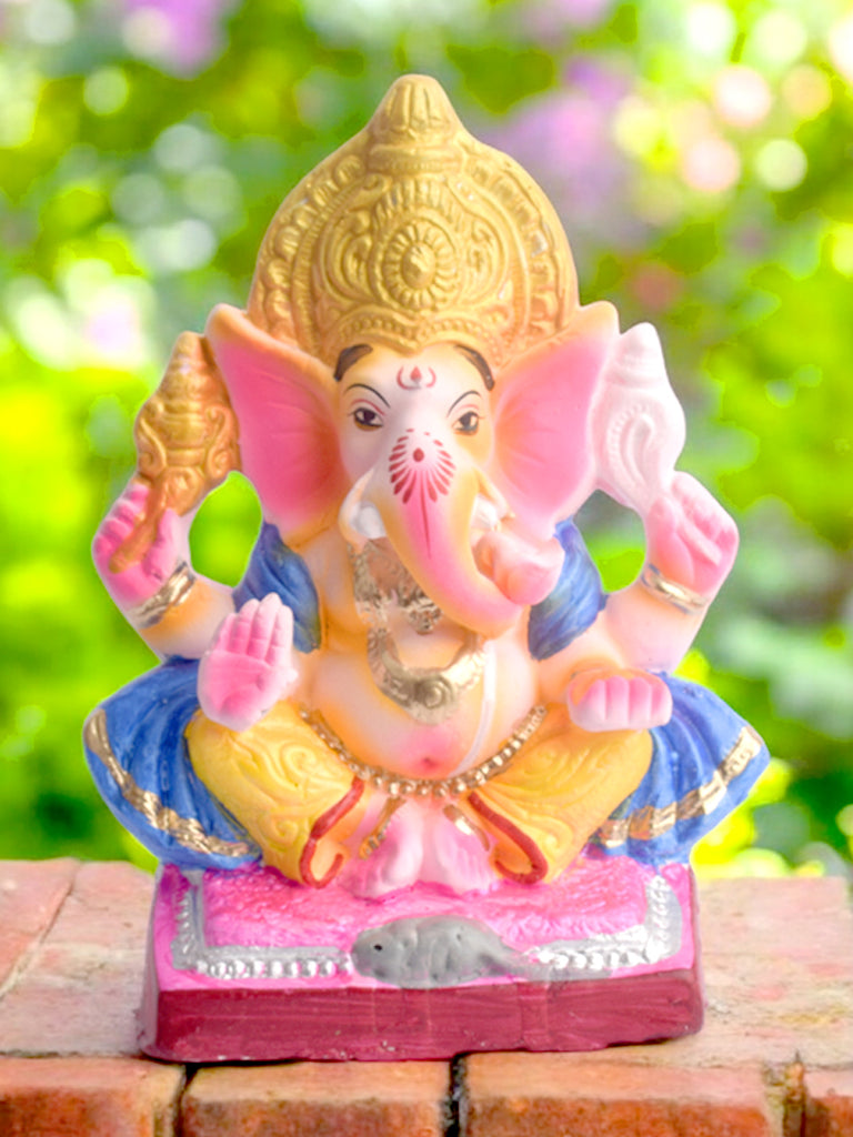8-inch Gajanan pose eco-friendly Ganpati idol adorned with a blue patka, handcrafted from natural clay for sustainable Ganesh Chaturthi celebrations. India’s Largest Pooja Accessories Brand – www.satvikstore.in