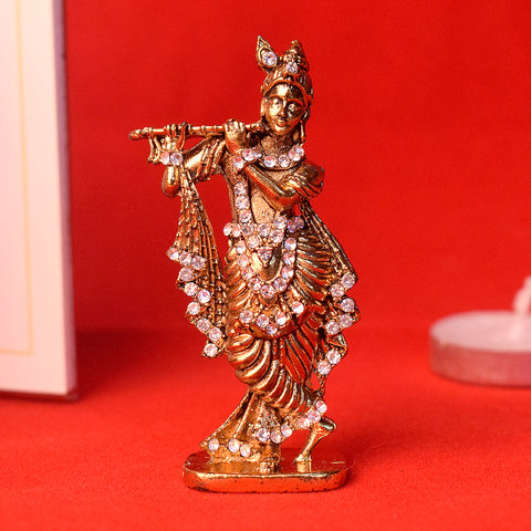 Golden Metal Krishna statue, beautifully crafted with intricate details, capturing Lord Krishna in a divine pose for spiritual devotion and worship. India’s Largest Pooja Accessories Brand – www.satvikstore.in 