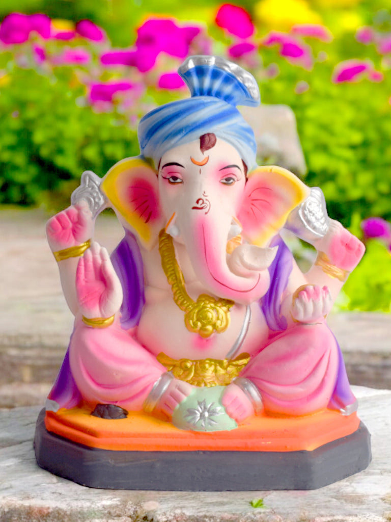 Vibrant 8-inch eco-friendly Ganesha idol in a relaxed sitting pose, beautifully handcrafted with colorful natural clay for Ganesh Chaturthi. India’s Largest Pooja Accessories Brand – www.satvikstore.in