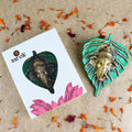 1 Pc Lord Ganesh Face on Leaf Patta Wall Hanging Green – Beautiful green leaf-shaped wall hanging with Lord Ganesha’s face embossed for spiritual and decorative home appeal. India’s Largest Pooja Accessories Brand – www.satvikstore.in